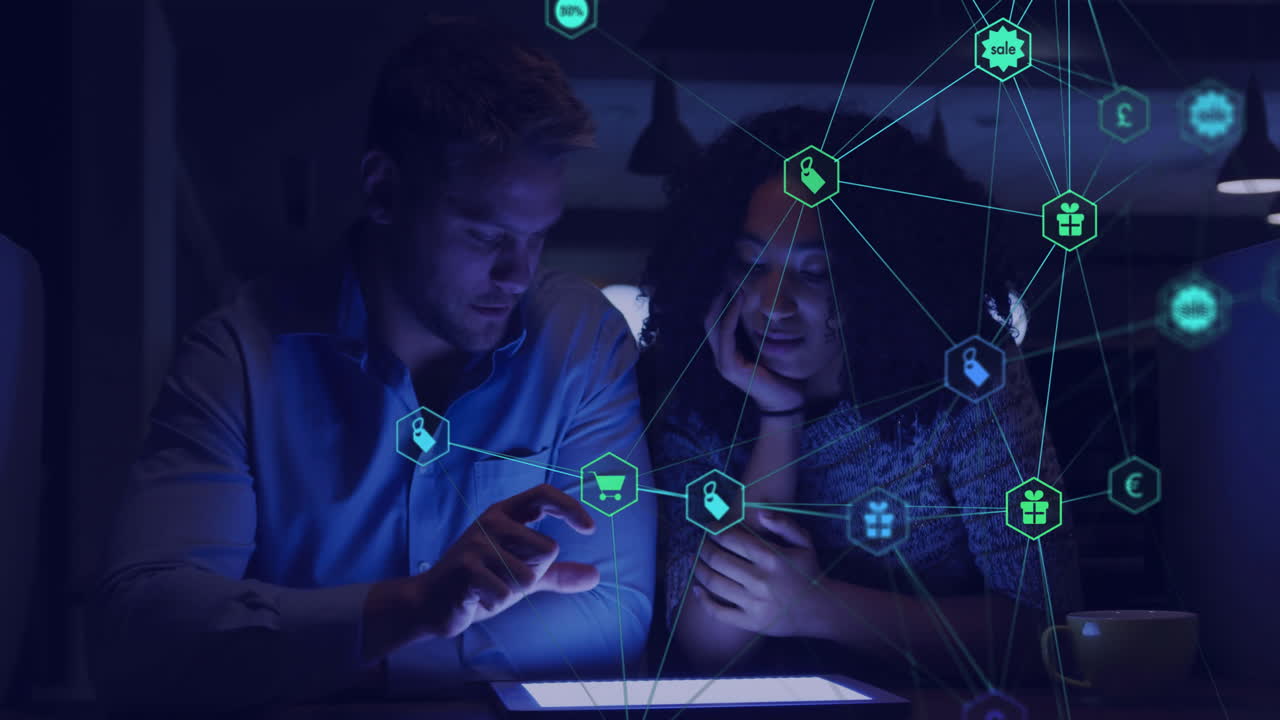 Animation of network of connections with icons over diverse colleagues using tablet in office