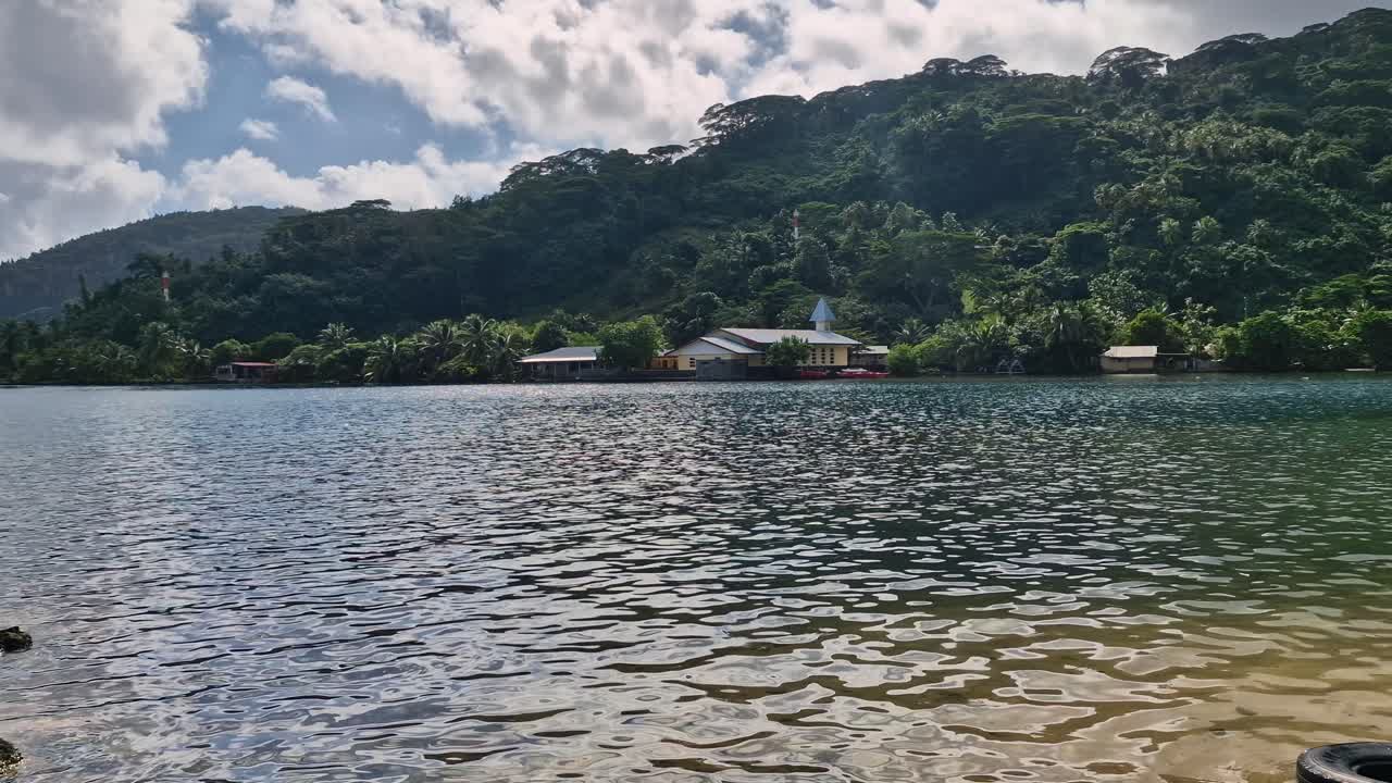 View of a church and trees by the lake