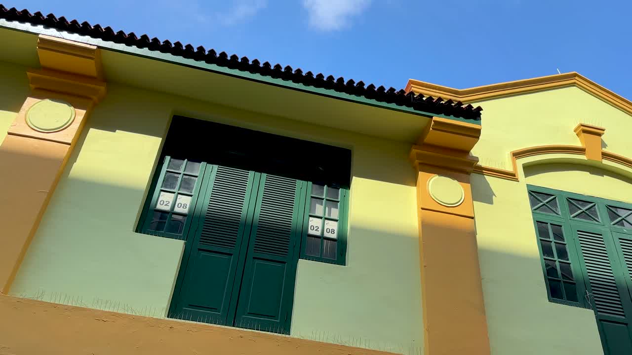 Vibrant buildings, festive decorations, and clear skies in Singapore’s Little India neighborhood