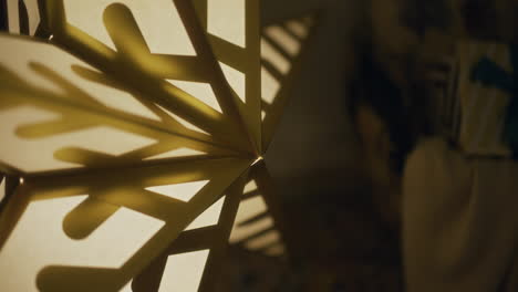 close-up of ceramic houses christmas decorations with a candle lit inside the house