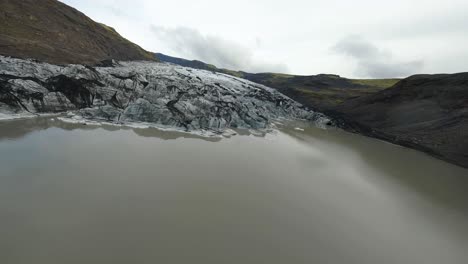 fpv shot over melting solheimajokull glacier during summer due to climate change