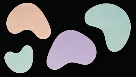 abstract pastel shapes on black background