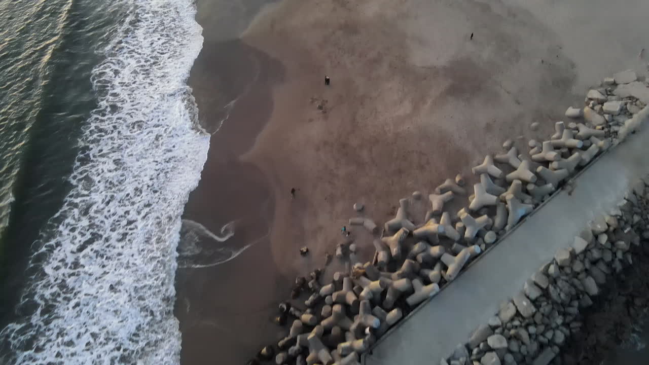 Aerial view of Santa Cruz Breakwater (Walton) Lighthouse shot in 4k high resolution