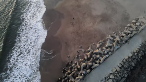 aerial view of santa cruz breakwater (walton) lighthouse shot in 4k high resolution