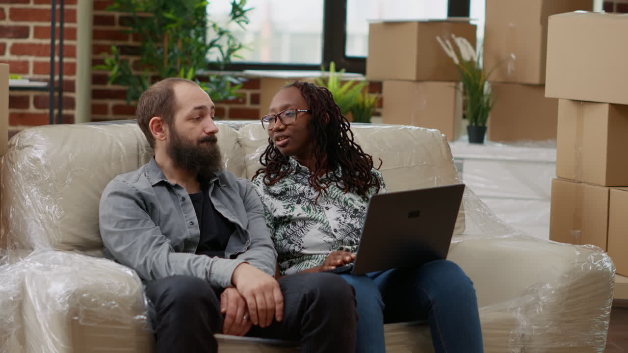 Diverse couple searching decor inspiration and furniture