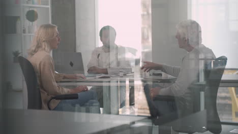 a young black doctor in a medical consultation with a ederly couple 3