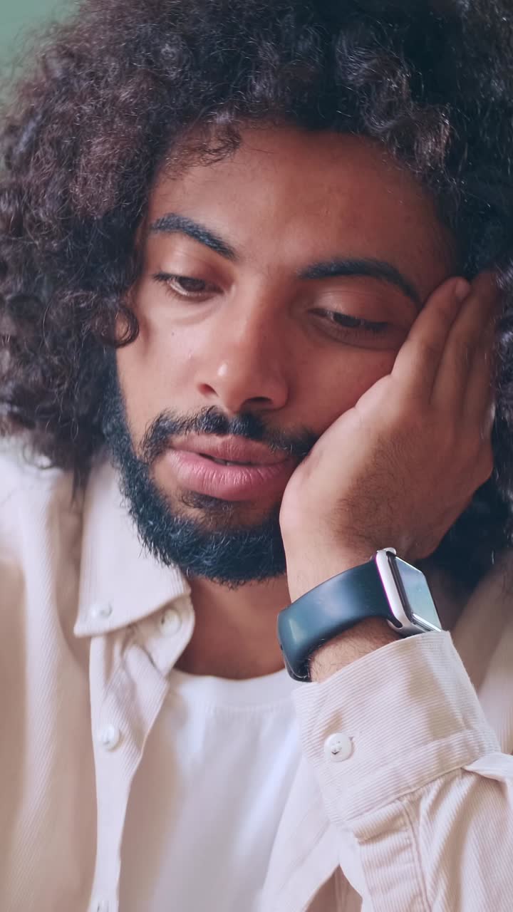 Emotional contemplation in a cozy cafe during a rainy afternoon