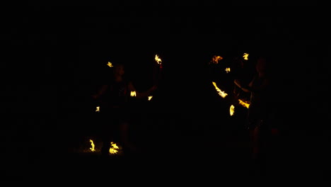 fire jugglers at night