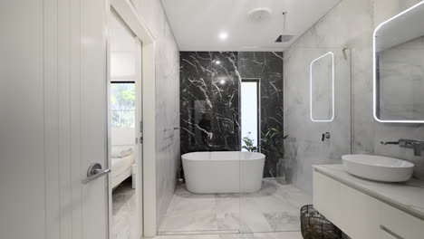 modern luxurious marble tiled bathroom freestanding bath led mirror sleek vanity white counter basin freestanding bath