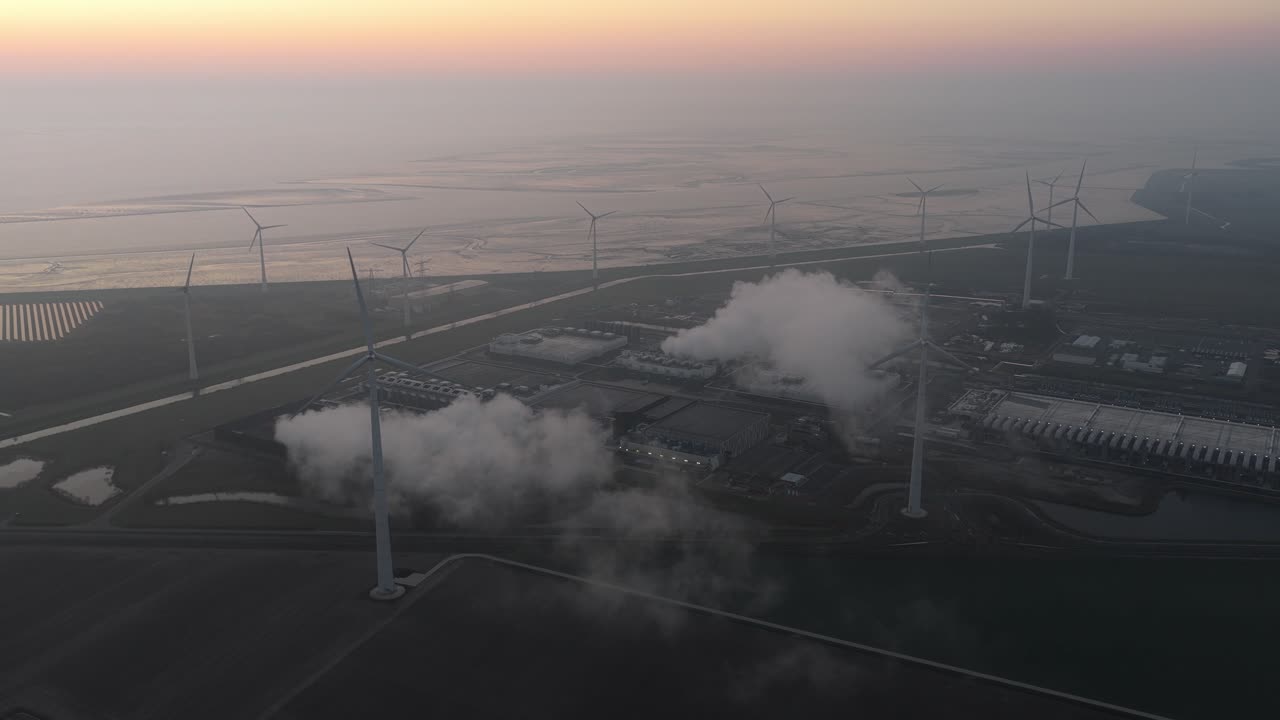 Google data center with wind turbines and cooling system aerial view at dawn