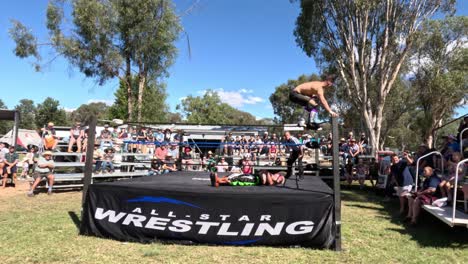 wrestlers performing at an outdoor event