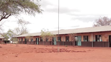 slider shot of a school in the rural africa in a semi arid area, kenya africa