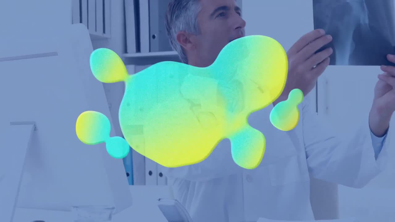 animación de mancha azul y amarilla sobre el médico usando computadora