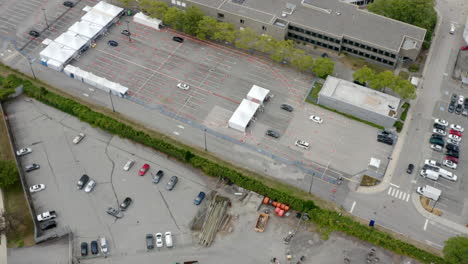 Cars-Lined-Up-In-Queue-At-Covid-19-Drive-Thru-Testing-And-Vaccine-Site-At-Daytime