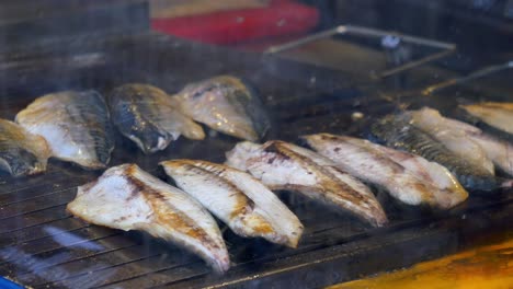 grilled fish on a street food grill