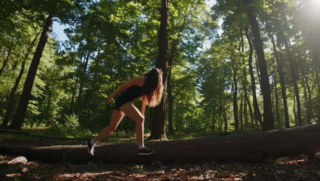 woman hiking through a sunny forest