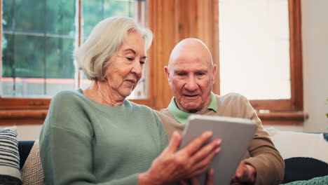 excited, tablet and senior couple on sofa high