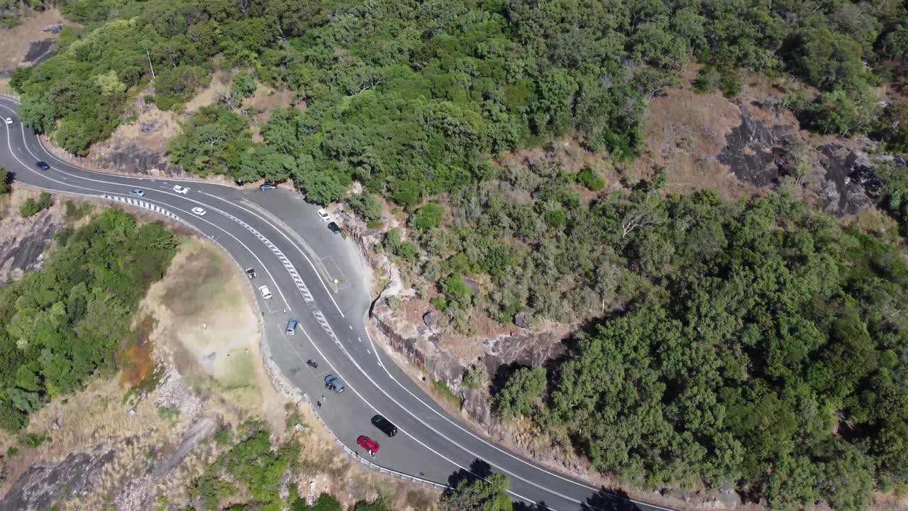 4K Aerial view of a coastal highway near a cliff in North Queensland, Australia
