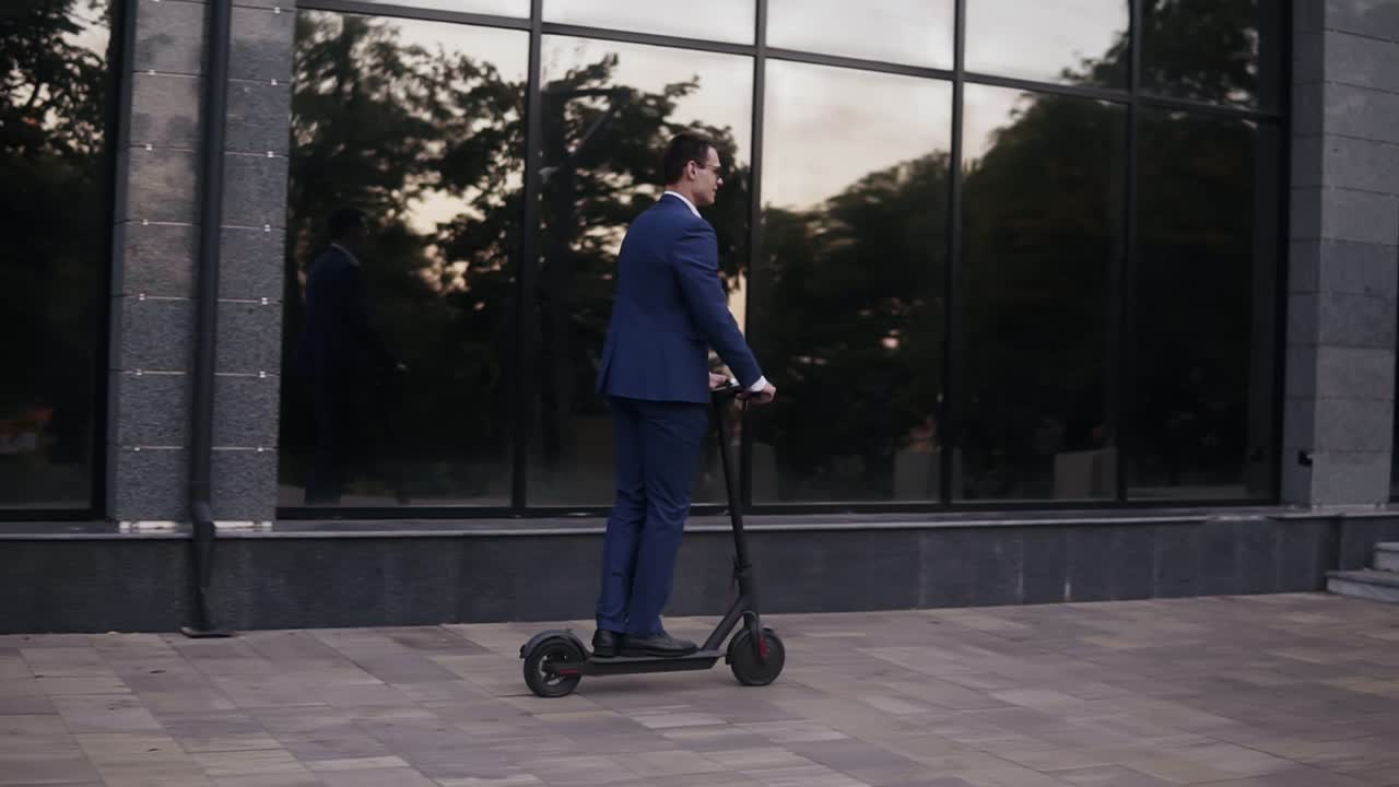 Young businessman riding and electric scooter for a business meeting in the office, office buildings, businessman, electric