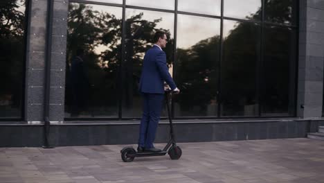 young businessman riding and electric scooter for a business meeting in the office, office buildings, businessman, electric