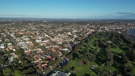 Overhead-shot-of-Perth-City-and-the-golf-course-of-Royal-Perth-Golf-Club,-Western-Australia,-aerial-dynamic-panning