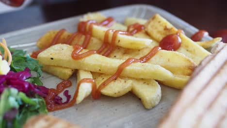 delicious fries with ketchup and salad