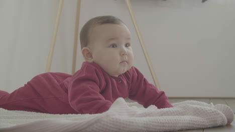 cute baby lying on the floor 1