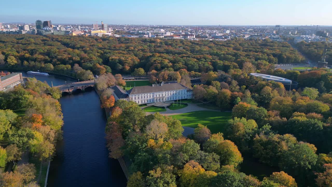 Schloss bellevue palace nestled among vibrant autumn foliage in tiergarten park, berlin, germany. Marvelous aerial view flight speed ramp hyper motion time lapse
