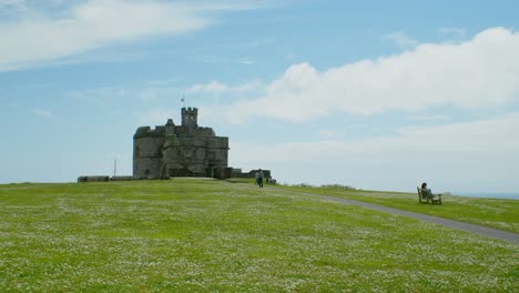 pendenis castle wide angle with tourists sunny day