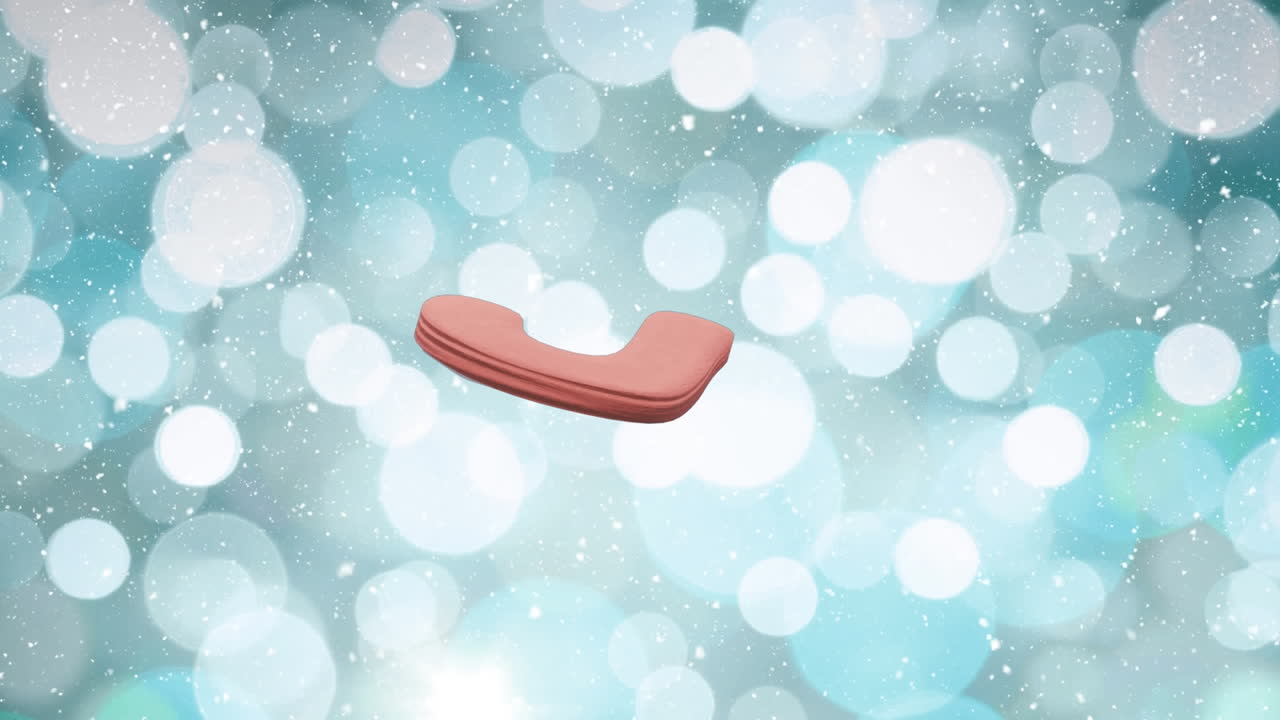 Animation of christmas candy cane gingerbread cookie over snow falling and bokeh lights