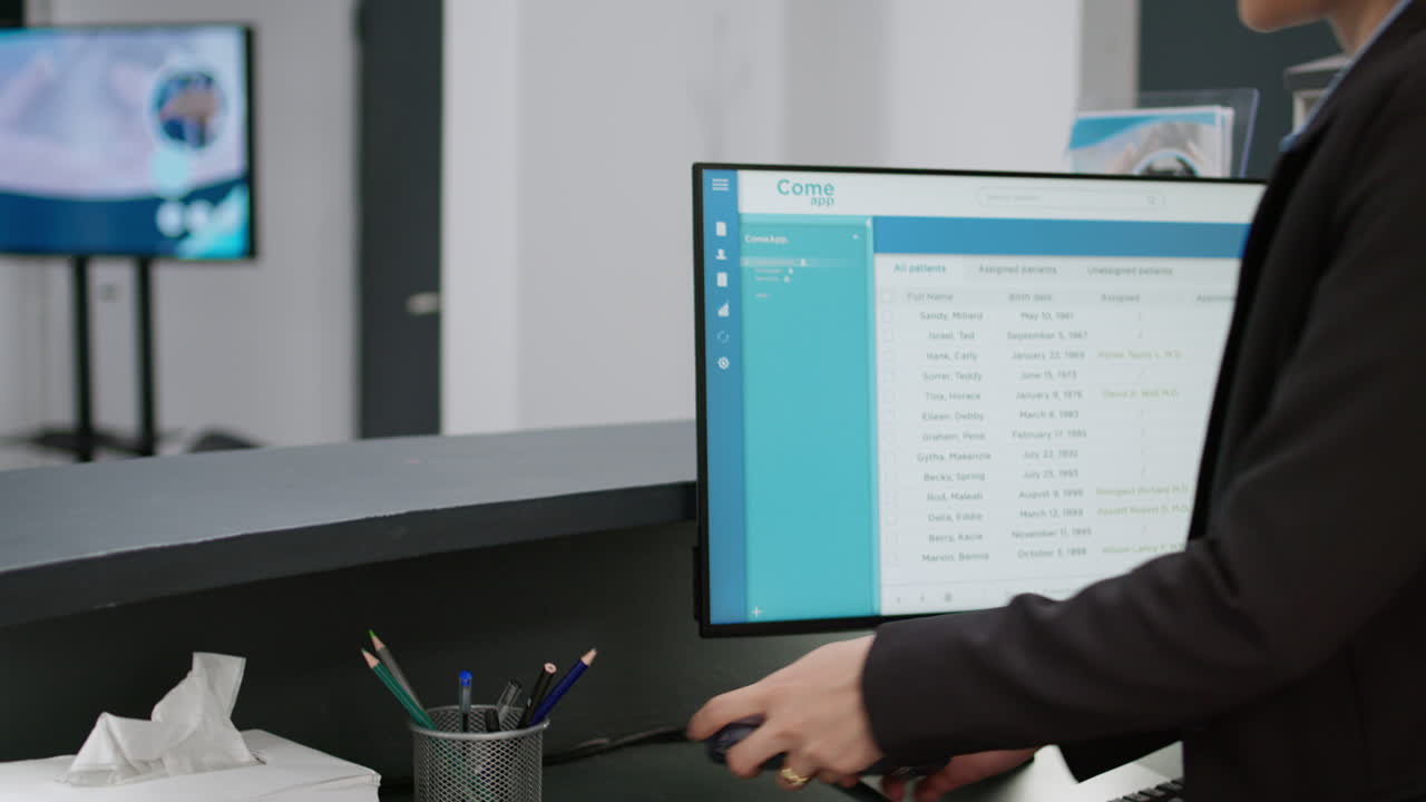 Patient checking in at clinic reception