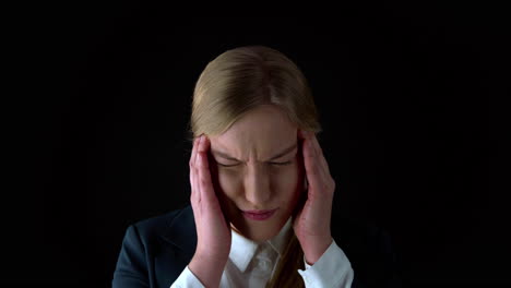 close up potrait of young woman with extreme headache press head with finger