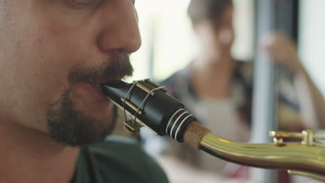 close-up of a musician playing saxophone