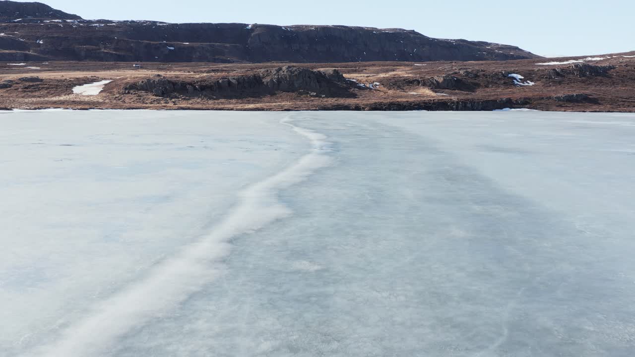 Ice sheet on Urriðavatn lake in east Iceland, aerial