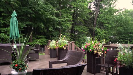 Woodland-porch-after-a-storm,-light-rain