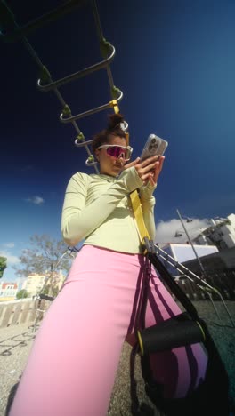 woman taking a selfie during a workout session in a park
