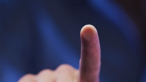 index finger of caucasian man using digital interface applying fingerprint to touchscreen