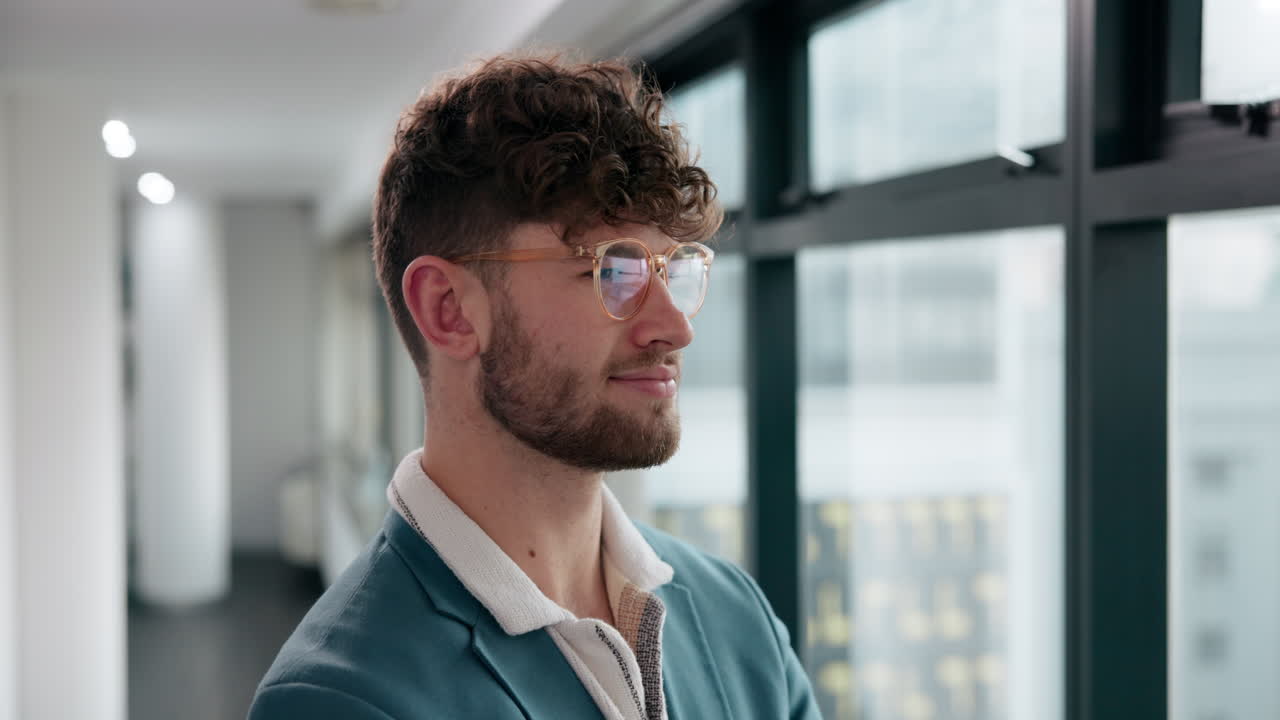 Portrait of a man wearing eyeglasses in an office