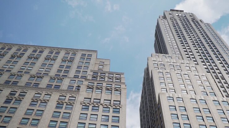 Manhattan, New York City, Low Angle View of Corporate Buildings Under Summer Sky