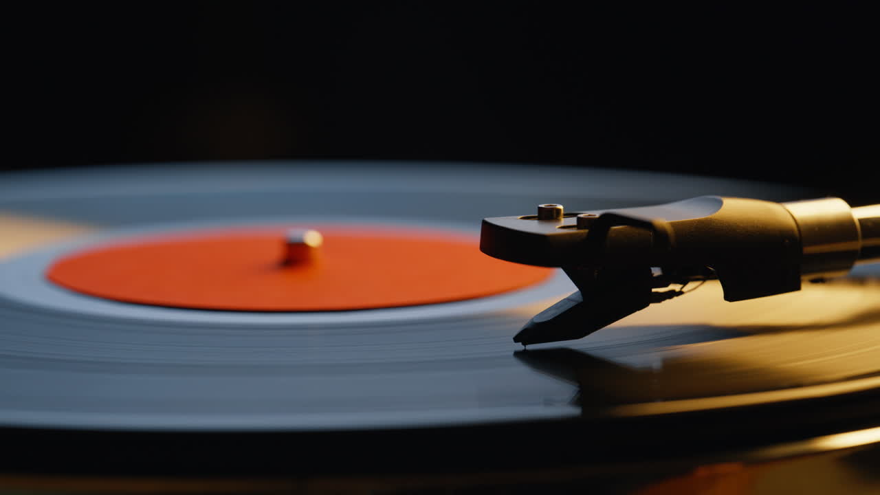 Classic stylus tracing grooves of vinyl record closeup. Retro equipment needle