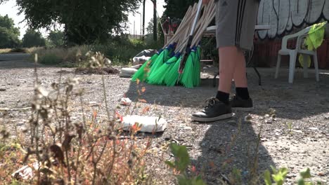 conceptual slow motion footage young boy picking garbage in milan suburbs