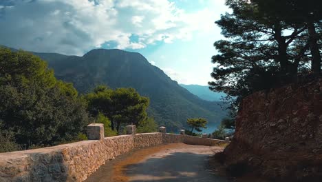 walking-in-a-road-towards-to-a-cliff-with-a-beautiful-beach-and-mountain-on-it---Kabak-,-Turkey