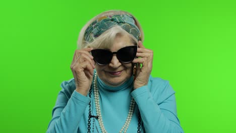 Elderly-stylish-caucasian-grandmother-woman-talking-on-mobile-phone.-Chroma-key