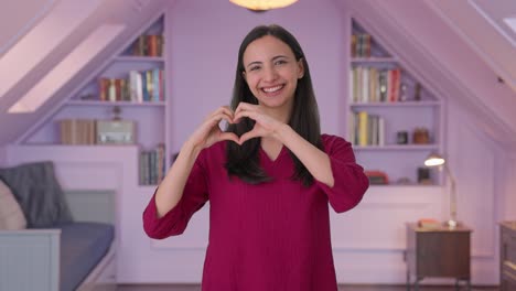 Happy-Indian-woman-showing-heart-sign