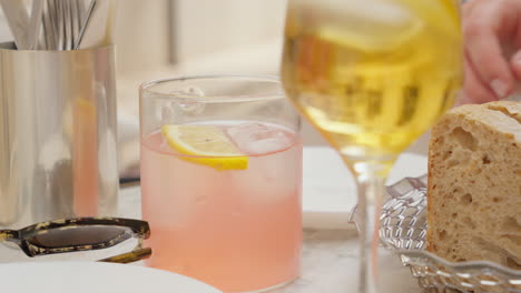 al fresco dining scene with refreshing drinks and bread