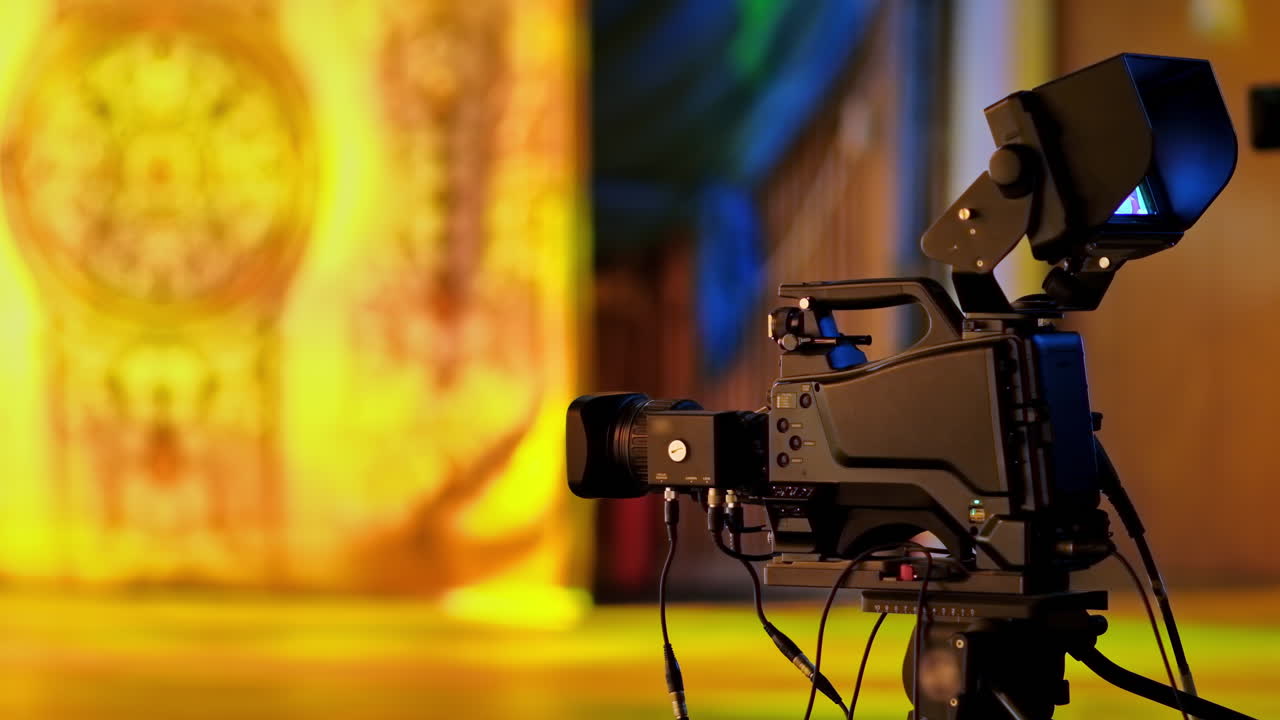 Professional camera filming with on the backstage of a TV set