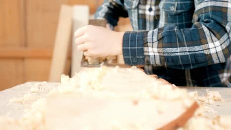 young boy learning woodworking