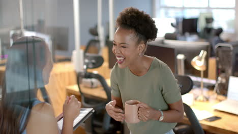 young african american woman shares a laugh in the business office