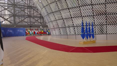 european flags and country member state flags inside the eu council building brussels, belgium