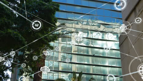 network connections and data processing animation over modern glass building